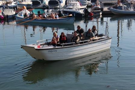 A group of people on an Accessible wheelchair friendly powerboat at Mylor Sailing School near Falmouth, Cornwall