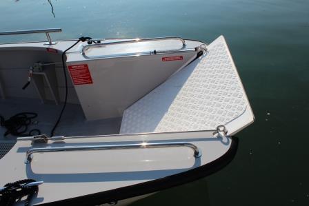 The front lowerable door of a wheelchair friendly powerboat at Mylor Sailing School in Falmouth, Cornwall