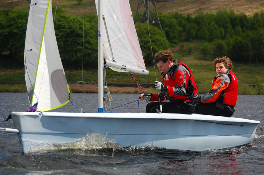 two men sailing a dinghy at Mylor Sailing School Falmouth Cornwall