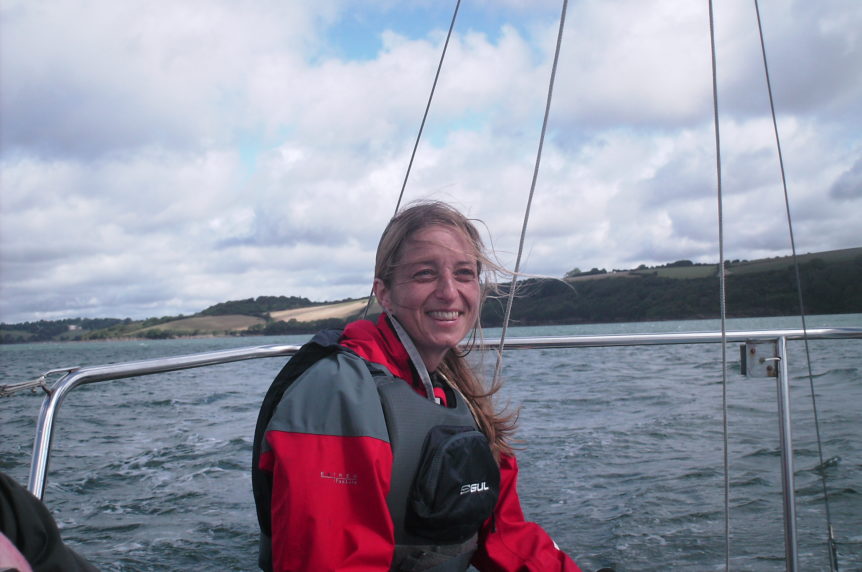 Ladies sailing on a small keelboat at mylor sailing school near falmouth