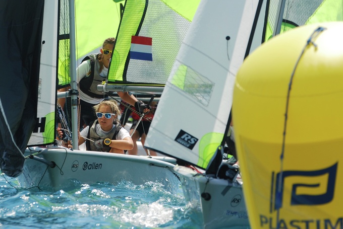 A few sailing dinghies racing close together at Mylor Sailing School Falmouth