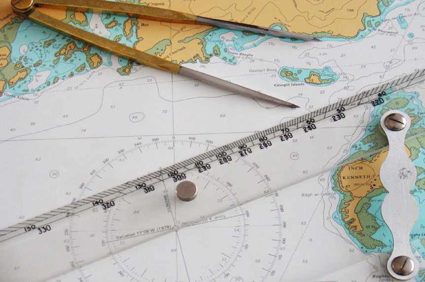 Navigation chart with dividers and ruler at Mylor Sailing School Cornwall