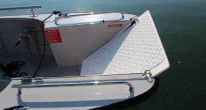 Front of wheelchair friendly powerboat, door able to lower down at Mylor Sailing School Falmouth Cornwall