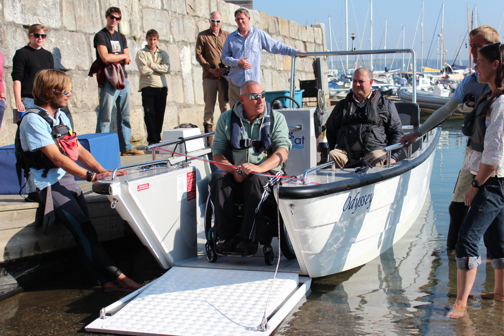 Wheelchair friendly powerboat on a slipway with front section lowered down at Mylor Sailing School in Falmouth, Cornwall