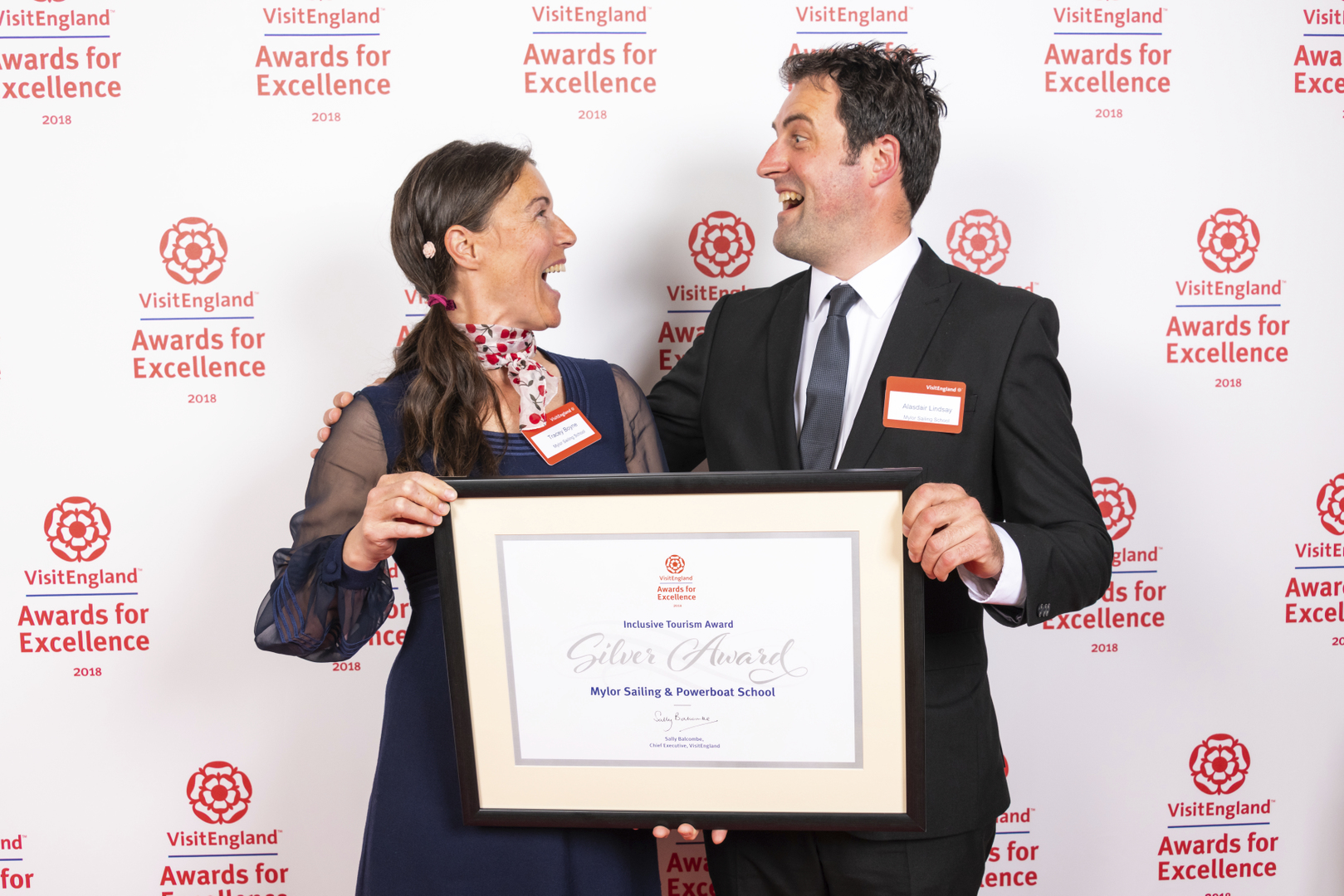 Owner Tracey Boyne with Visit England Award holding framed certificate