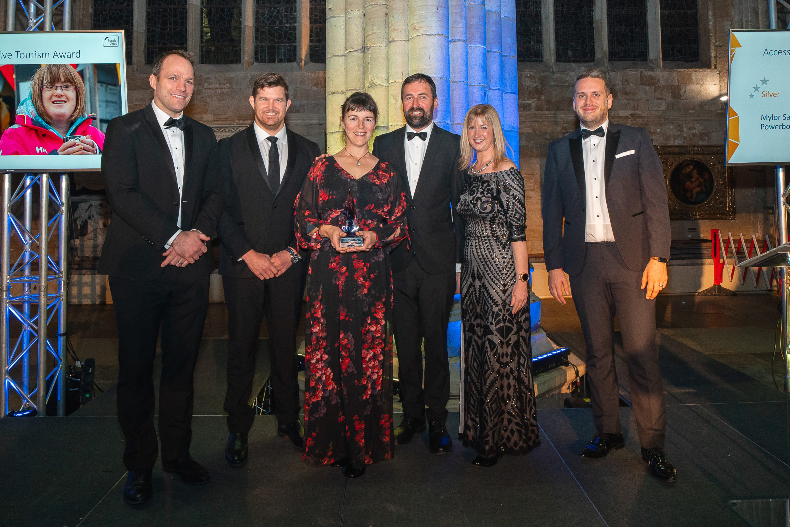 Six of the people in Exeter Cathedral accepting an award at the ceremony