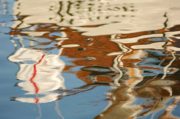 Reflections on calm waters of a sailing boat
